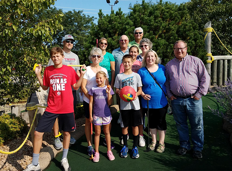 family golfing at thunder road